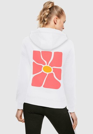 White hoodie featuring a large pink flower design with a yellow center on the back. Soft fabric, relaxed fit, and adjustable hood.