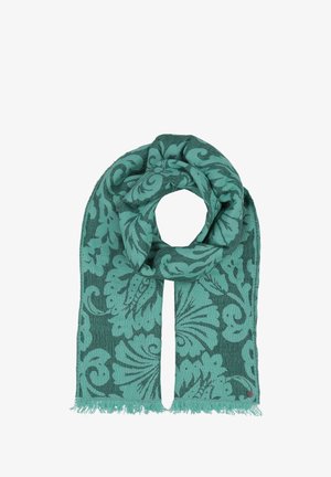 Sciarpa turchese con motivo floreale, realizzata in tessuto morbido. Accentuata da bordi frangiati. Ha una forma a loop per una facile indossabilità.
