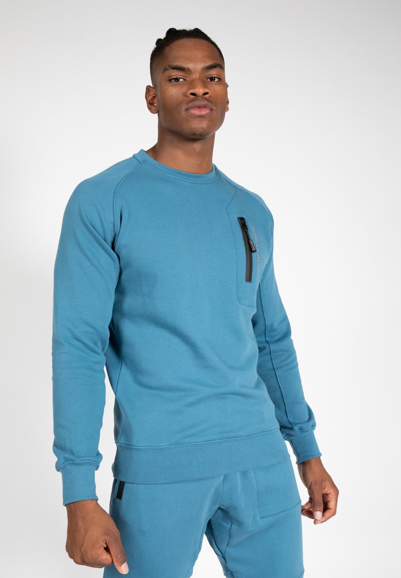 Blauwe lange mouwen sweatshirt met een ronde hals, zijzak met ritssluiting, geribbelde boorden en textuurstof. G combined met bijpassende broek.