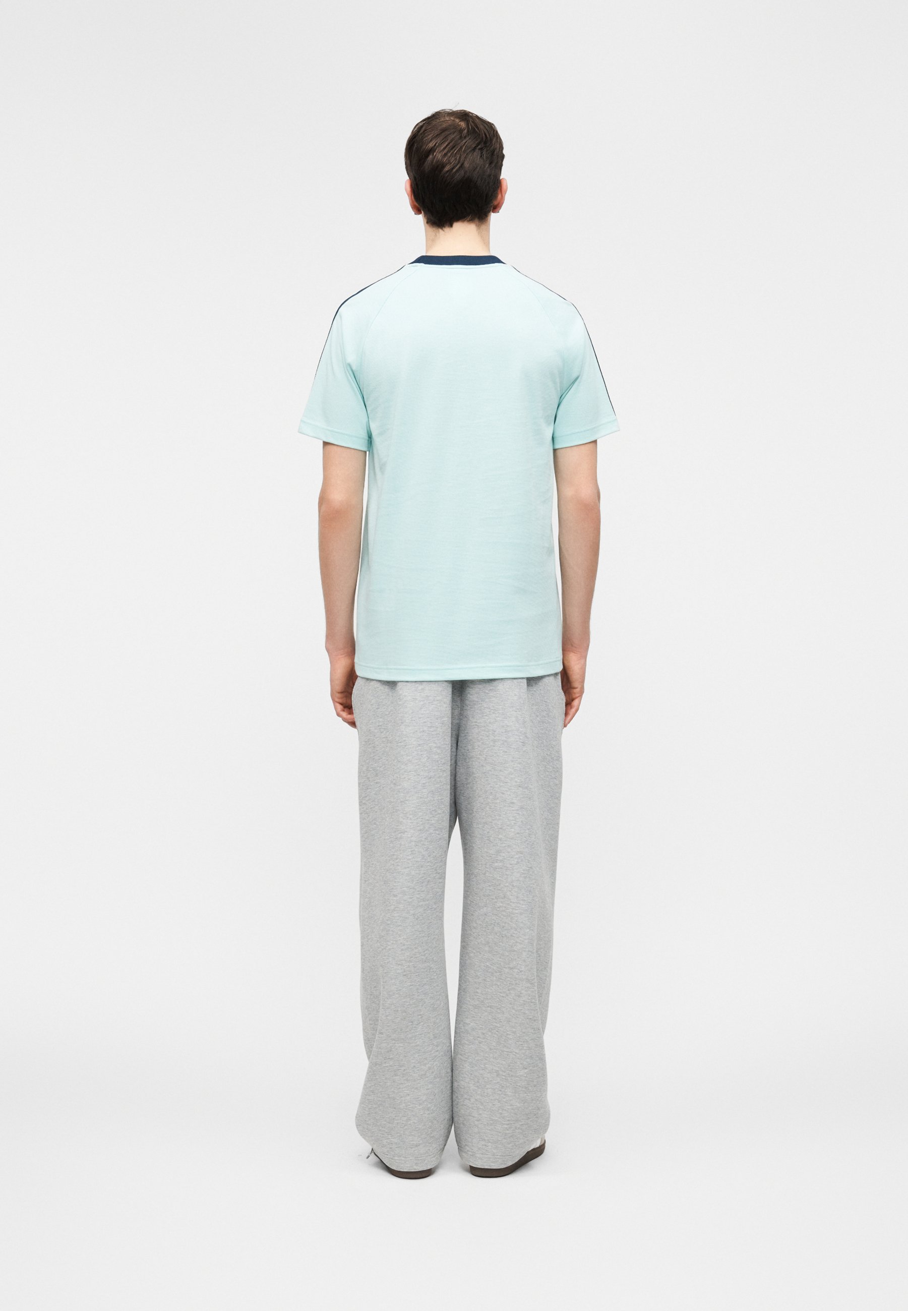 adidas Originals GERMANY ORIGINALS - Sports T-shirt - semi flash