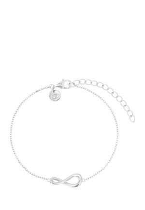 Pulsera delicada de cadena de plata con un símbolo de infinito en el centro y cierre ajustable con eslabones de extensión.