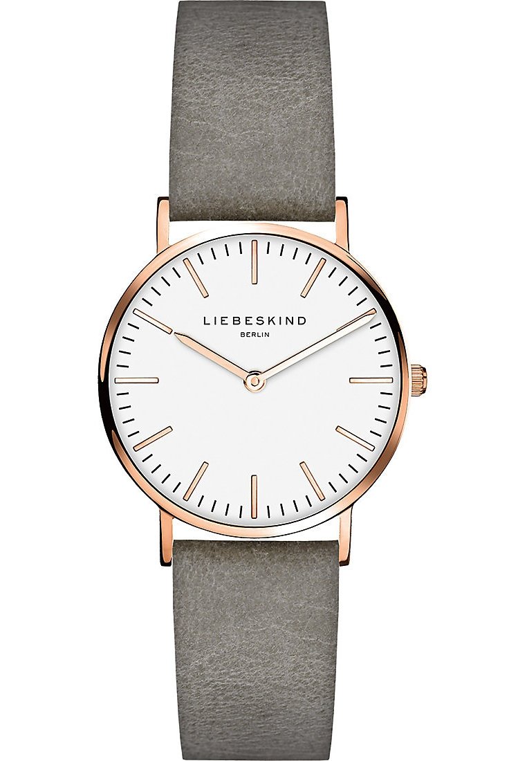 Rondvormig horloge met een witte wijzerplaat, kast in roségoudkleur, en grijze leren band. Bevat minimalistische uurmarkers en een enkele kroon.