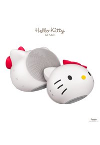 Hello Kitty Gesichtsreinigungsbürste aus weißem Silikon mit erhabenen grauen Borsten, rotem Schleifchen und gelber Nase. Abgerundete Form mit verspieltem Design.