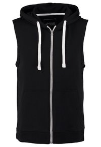 Sudadera sin mangas negra con cremallera y cordones blancos, bolsillos frontales, tejido suave y dobladillo acanalado en la parte inferior. Diseño simple y funcional.