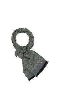 Écharpe en tissu doux à motif en chevrons gris, avec des franges noires et une bordure unie sombre. Le nœud au centre met en valeur sa drapé.
