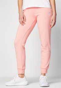 adidas Sportswear ESSENTIALS LINEAR CUFFED - Treniņtērpa apakšdaļas - semi pink spark