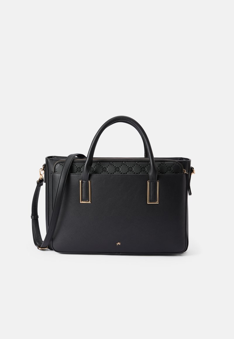 Black leather tote bag with dual handles, adjustable shoulder strap, gold hardware, and quilted upper panel with monogram pattern.