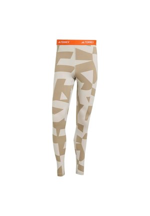 Leggings in a beige and cream color scheme with geometric patterns. Features an orange TERREX waistband. Made of stretchy material for comfort.