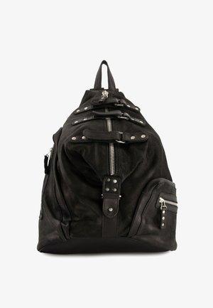 Black leather backpack with silver zippers, rivets, buckle straps, and multiple pockets, shown from the front against a white background.