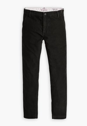 Chino en velours noir avec une coupe droite, doté d'une fermeture à bouton, de passants de ceinture et d'une texture subtile. Coupe standard, taille mi-haute.