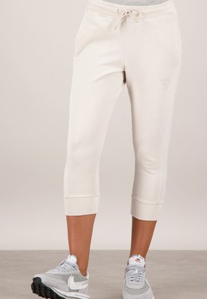 CARYL - Tracksuit bottoms - sand
