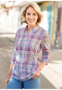 Camicia a quadri in colori pastello con maniche lunghe e chiusura con bottoni, realizzata in tessuto leggero, caratterizzata da un motivo a scacchi e tasche.