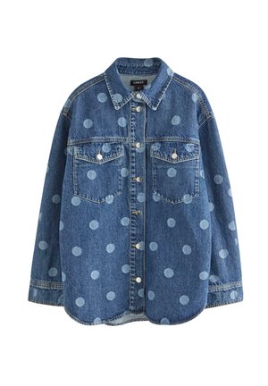 Camicia di denim con pois blu, maniche lunghe, colletto a punta, due tasche sul petto e bottoni a pressione. Tessuto morbido con vestibilità comoda.
