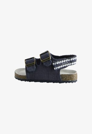 Sandale pentru copii, de culoare bleumarin, cu două curele reglabile cu cataramă, curea posterioară împletită, talpă interioară din plută și talpă exterioară din cauciuc negru.