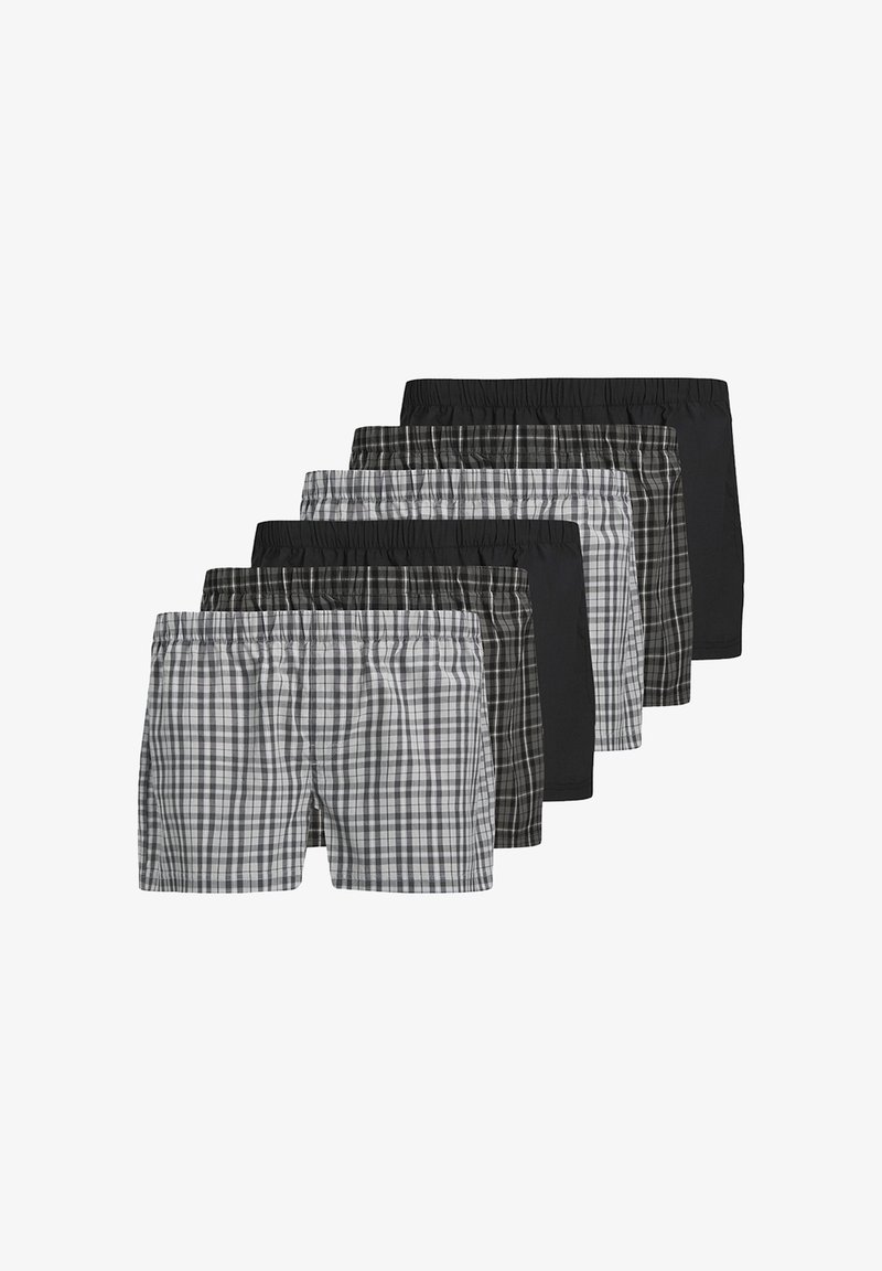 Six paires de shorts : deux à carreaux en noir et gris, quatre solides noirs, avec des ceintures élastiques et un tissu léger.