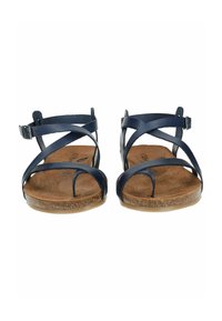 Navy blue leather sandals with crisscross straps, a flat cork-like sole, and an adjustable ankle buckle. Textured footbed visible.