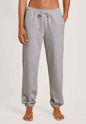 Grijze sweatpants van een zacht materiaal, met een elastische tailleband met een trekkoord, zijzakken en taps toelopende boorden bij de enkels.