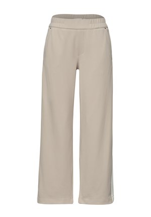 Beżowe spodnie szerokimi nogawkami z elastycznym pasem i bocznymi kieszeniami, zaprojektowane do noszenia na co dzień lub dla wygody.
