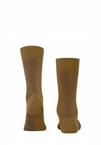 Brązowe, prążkowane skarpetki o teksturowanym wykończeniu i wzmocnionych piętach, w jednolitym kolorze i długości do połowy łydki.