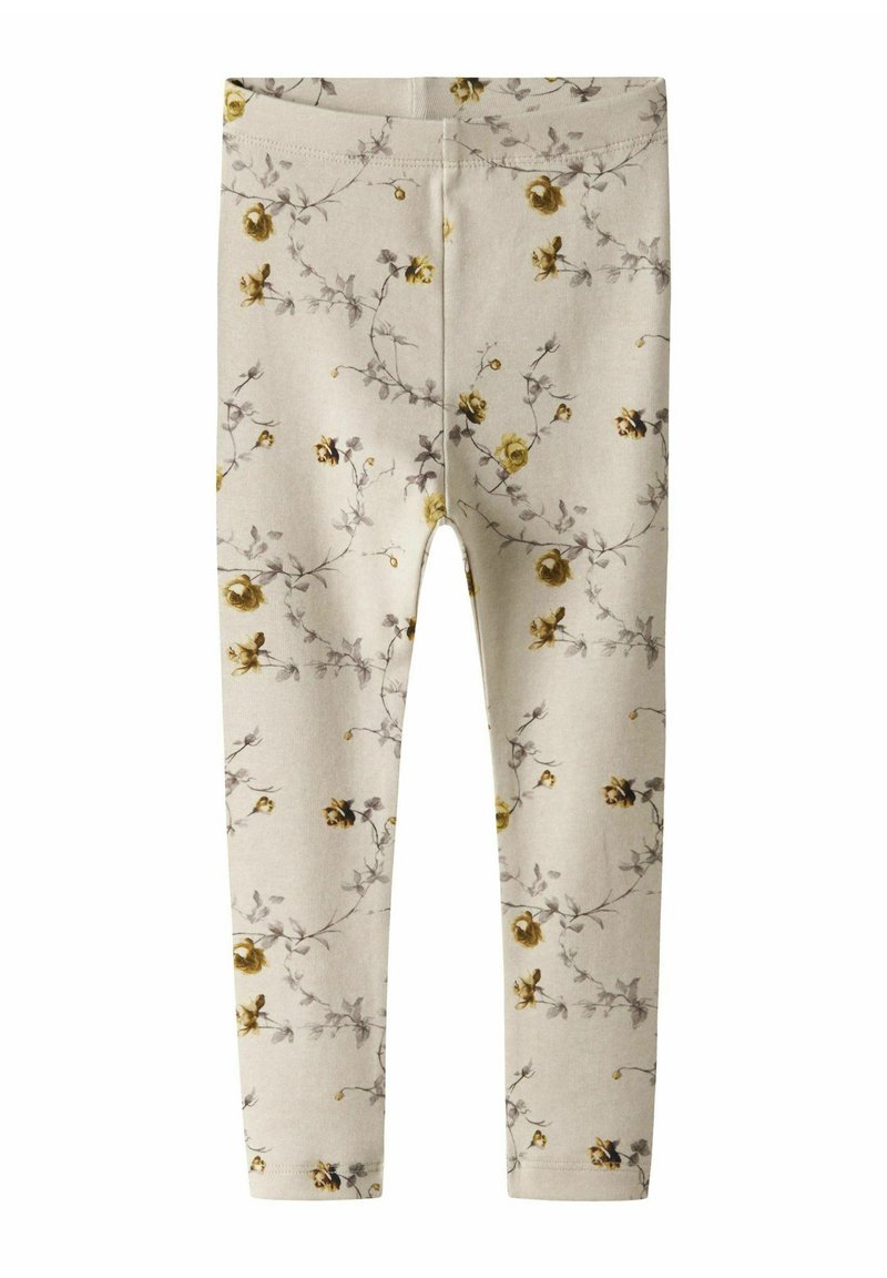 Gai beidzis legingi ar ziedu rakstu, kurā redzami dzelteni rozes un pelēki vīteņi. Mīksta auduma, pieguļošs dizains, elastīga jostasvieta.