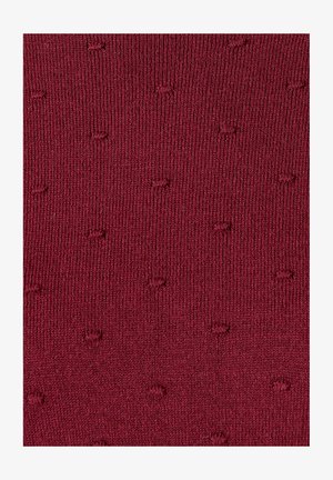 Calzini bordeaux con un motivo testurizzato, caratterizzato da piccoli punti in rilievo. Realizzati in materiale lavorato a maglia, offrono una finitura morbida.