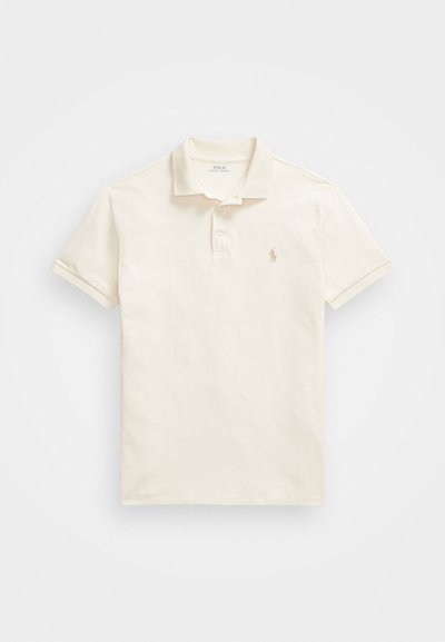 Short sleeve polo shirt in off-white cotton, featuring a classic collar, three-button placket, and subtle embroidered logo on the chest.