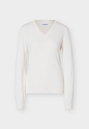 White long-sleeve V-neck sweater with ribbed cuffs and hem, featuring subtle logo embroidery on the left chest.