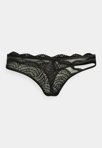 String noir en dentelle avec bordure en feston et motifs de vagues géométriques. Présente des côtés ouverts et une texture douce et transparente.