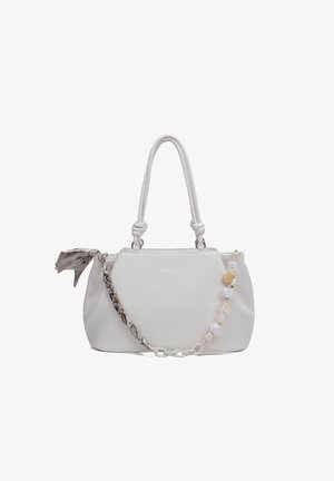 White leather handbag with knotted handles, decorative braided scarf on one side, and chunky bead chain on the other side.