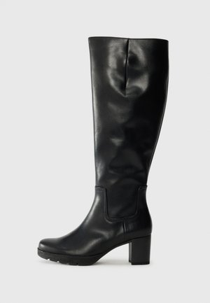 Black knee-high boots made of smooth leather with a chunky heel and a rounded toe. Features minimal stitching and a modest, sleek design.