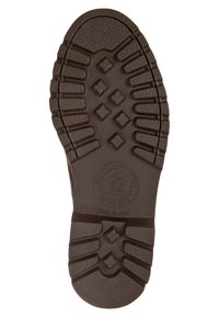 Suola di scarpa in gomma nera con superficie testurizzata, dotata di un motivo a losanga e un logo circolare. Progettata per aderenza e durabilità.