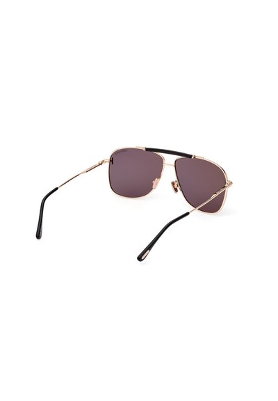 Gold metal frame sunglasses with dark gradient lenses, a geometric design, and black temple accents for added contrast. Lightweight construction.