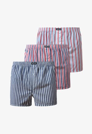 Three pairs of boxers in varying colors and patterns: one navy blue with white stripes, one light blue and red striped, and one red and white striped.