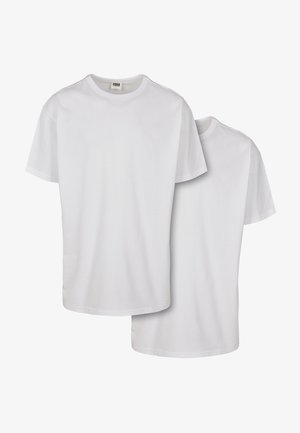 Weiße Baumwoll-T-Shirts mit kurzen Ärmeln, runden Ausschnitten und glatter Textur, gezeigt übereinandergestapelt mit einem leicht überlappenden Vorderteil.