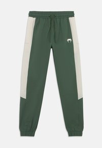 Πράσινο παντελόνι φόρμας με κρεμ πλαϊνές φάσες, ελαστική μέση, κορδόνι και ριμπ μανσέτες· διαθέτει μικρό λευκό λογότυπο στο μπροστινό μέρος.