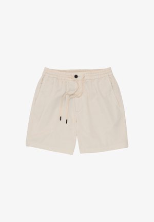 Beige Freizeithosen mit elastischem Bund, Kordelzug, Knopf und Seitentaschen, geeignet für legere Kleidung.