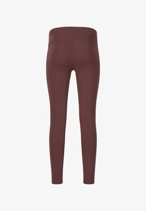 Leggings marron taille haute en tissu lisse et extensible. Design ajusté avec une construction sans coutures et sans matériel visible.