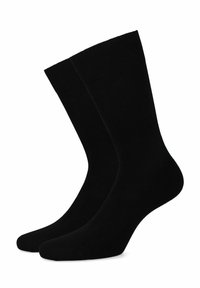 Czarne skarpetki bawełniane typu crew o gładkiej fakturze, wzmocnionym mankiecie i bezszwowym wykończeniu palców. Odpowiednie do różnych stylów obuwia.