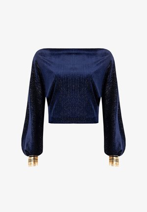 Marineblauwe cropped top met glanzende textuur, lange pofmouwen en gouden metallic manchetten. Soepele stof met geribbelde details op de mouwen.