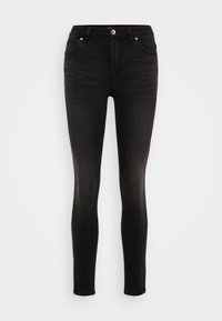 Jeans negros ajustados de mezclilla, con un diseño clásico de cinco bolsillos y cierre frontal de botón. Textura suave y forma ceñida.