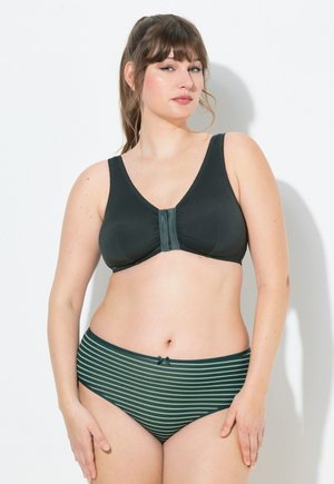 Schwarzer gepolsterter BH mit V-Ausschnitt, Mittelverschluß und gerippten Trägern. Kombiniert mit hochgeschnittenen Slips mit grünen Streifen und einer Schleifendetail.