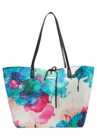 Sac fourre-tout avec poignées noires présentant des motifs floraux abstraits vibrants en bleu, vert, rose et violet sur un fond blanc.