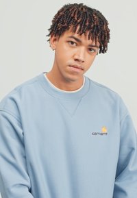 Carhartt WIP AMERICAN SCRIPT - Mikina - frosted blue