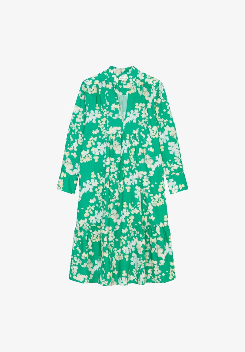 Robe verte à manches longues avec imprimé floral blanc, encolure en V et coupe ample et fluide. La robe arrive sous le genou.
