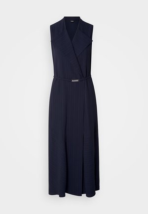 Navy blue sleeveless dress with a shawl collar, pinstripe pattern, wrap design, and a thin belt featuring a silver buckle detail.