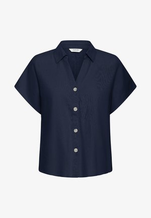 Tumesinine lühikeste varrukatega särgi, millel on krae ja neli valget nööpi ees.