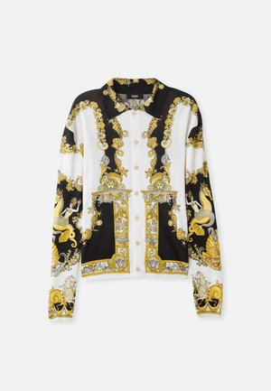Camisa de botones en blanco y negro con un patrón barroco dorado, diseños intrincados con conchas marinas, sirenas y detalles de hardware decorativos.
