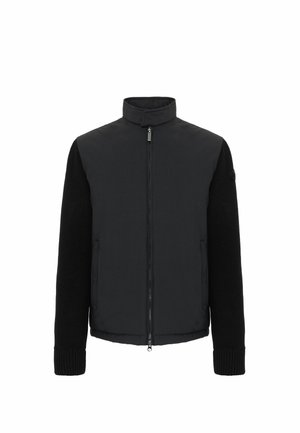 Zwarte jacket met een gevoerd lichaam en gebreide mouwen, voorzien van een staande kraag, vooraan een rits en ribgebreide manchetten.