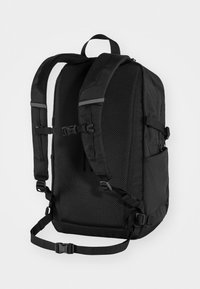 Black backpack with padded mesh back, adjustable straps, and side pocket. Features clips and straps for secure fastening.