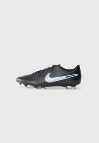 Black soccer cleat with textured leather upper, blue swoosh logo, and light blue studs. Features a sleek design and lace-up closure.